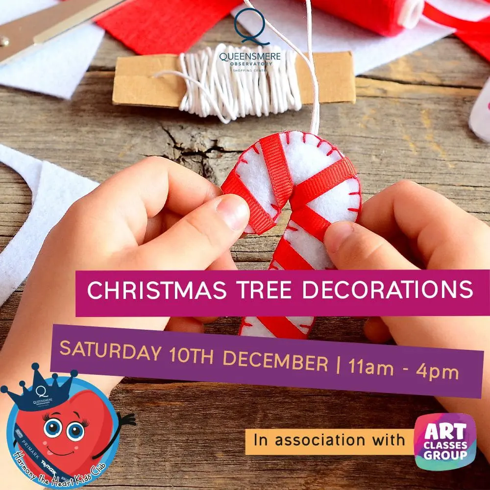 A person holding onto a christmas tree decoration