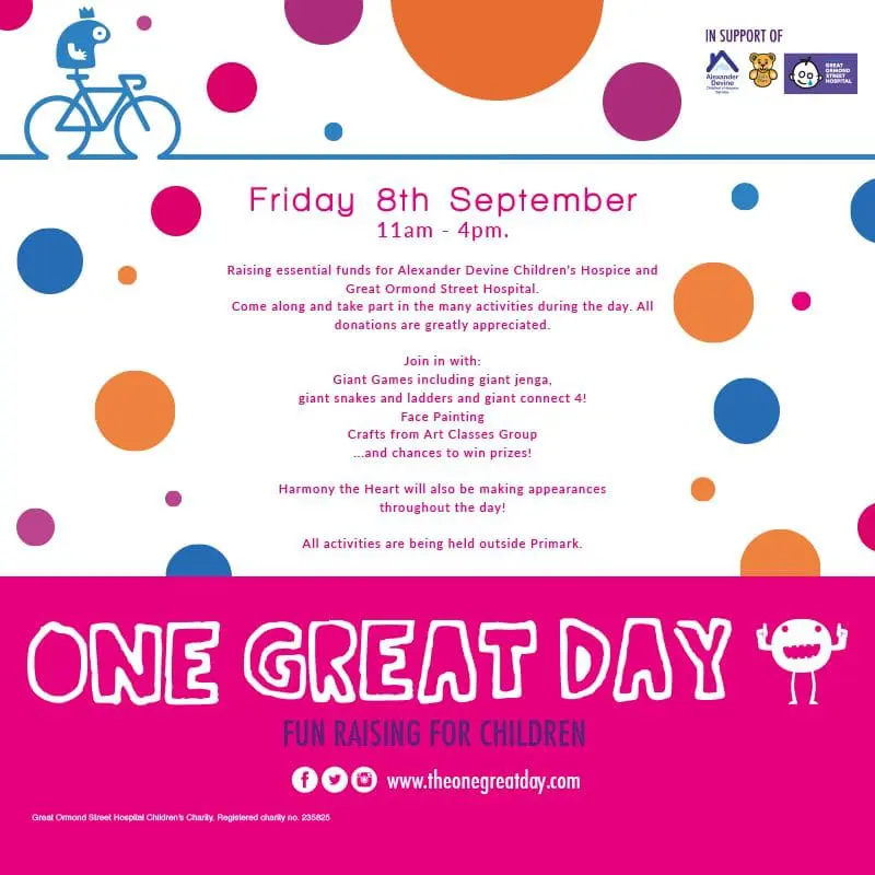 A pink and orange polka dot background with a bicycle on it.