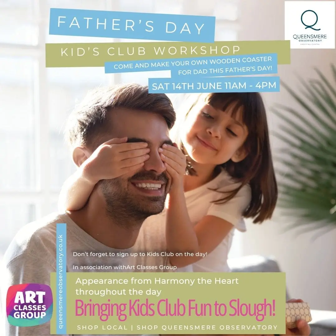 Father and daughter smiling together, playful moment.